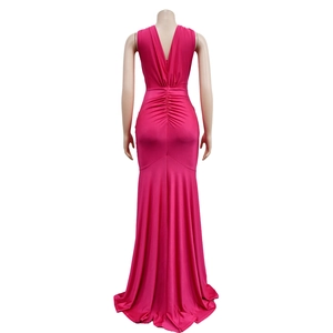 Detailed back view of a magenta mermaid dress featuring elegant ruching and a deep V-back