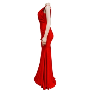 Detailed view of red satin evening gown featuring elegant side ruching and slim fit design