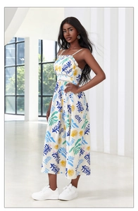Close-up of shell print midi dress with high-waisted design and delicate pleat details