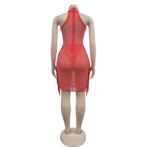 Detail view of red mesh halter dress featuring silver rhinestones and long side tassels