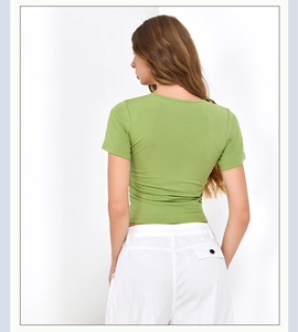 Slim fit grass green short sleeve crop top with round neck and ribbed knit texture