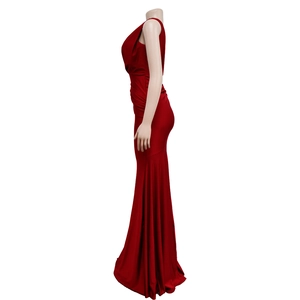 Detail of red satin evening dress featuring pleated waist and elegant mermaid skirt