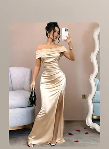 Champagne gold satin gown with off-shoulder neckline and side slit detail
