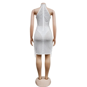 Detail of white bodycon dress with silver rhinestone diamond lattice pattern and back zipper