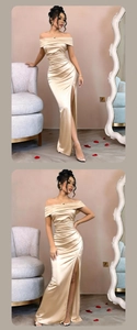 Detail of elegant off-shoulder champagne satin evening gown with waist draping and high slit