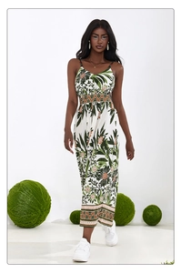 Close-up of bohemian floral print dress featuring tropical leaf patterns and pleated fabric
