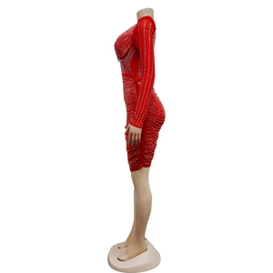 Detail view of red bodycon dress with sparkling silver rhinestones and long sleeves