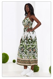 Detail of floral maxi dress showing thin straps with colorful beads and V-neckline pattern
