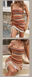 Detail of bohemian knit dress featuring side drawstrings and vibrant ethnic geometric patterns