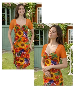 Detail of orange mesh sleeves and gold heart buckle on sunflower flag print dress