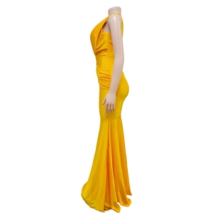 Detail of yellow satin maxi dress showing ruched waist and elegant fishtail hemline