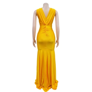 Detail of back ruched design and fishtail hem on a yellow v-neck evening maxi dress