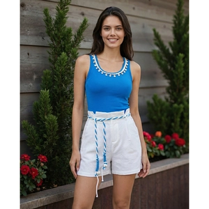 Women's summer resort set with blue tank top and white cotton linen shorts