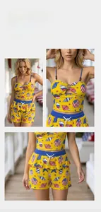 Close-up of ocean-themed starfish shell print on yellow camisole and ruffled shorts