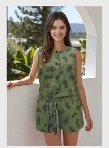 Detail of bohemian floral print set with woven drawstrings and textured seersucker fabric