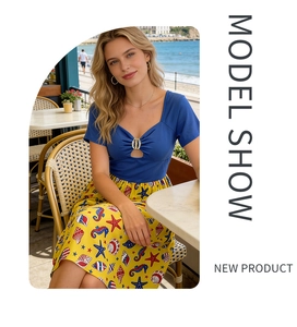 Detail of cutout bodice with golden buckle and nautical print midi skirt design