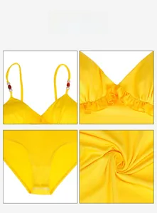 Detail display of yellow V-neck swimsuit with lace trim and beaded shoulder straps