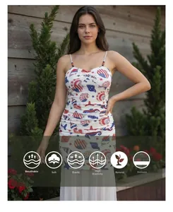 Detail view of the shell and starfish print with wood bead straps on the mesh dress