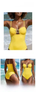 Detail of yellow one-piece swimsuit with sun-shaped metal buckle and pleated design