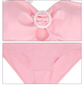 Detailed close-up of pink bikini fabric, showing stitching and white decorative ring