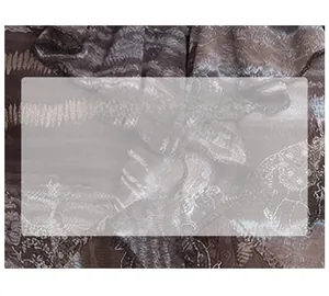 Detailed macro view of vintage floral pattern on soft brown breathable fabric texture