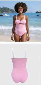 Detail of pink one-piece swimsuit featuring unique white ring straps and waist cutout