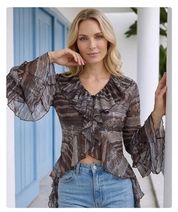 Detail of V-neck lace ruffle top with elephant print and flared sleeves in brown and blue