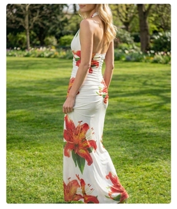Detail of white maxi dress with lily print showing the halter back and ruched waistline