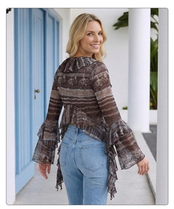 Detail of V-neck top with elephant print, flared sleeves and ruffled chiffon hem