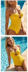 Detail of yellow halter neck swimsuit showing bead accents and silver ring cutout