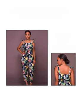 Detail of tropical pineapple print on navy blue jumpsuit with ruffles and tie straps