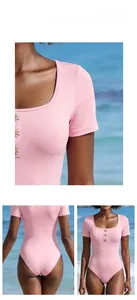Detail view of pink square neck swimsuit with metal buttons and short sleeve design
