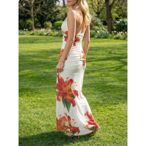 Slim fit halter neck maxi dress featuring vibrant lily floral print and open back