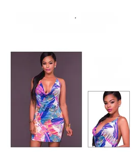 Close-up of a tropical print halter mini dress featuring a deep V-neck and open back detail