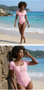 Detail view of pink one-piece swimsuit with floral metal buttons on the U-neckline