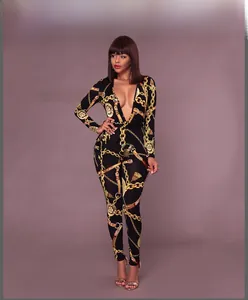 Detail of slim fit long sleeve jumpsuit with gold chain and baroque print patterns