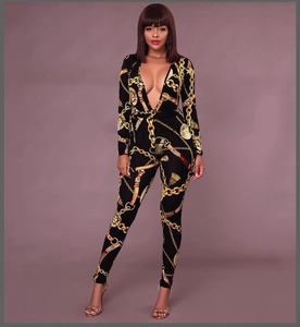 Detail of baroque chain print on deep V-neck slim fit jumpsuit with waist tie