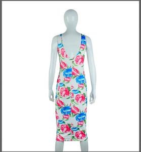 Detail of floral midi dress back view with vibrant red and blue flowers and deep V-neck