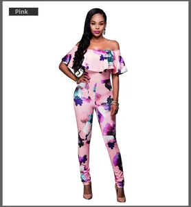 Detail of the off-shoulder ruffle neckline and pink tropical floral print on the jumpsuit