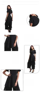 Detail view of black short sleeve chiffon jumpsuit with tiered bodice and wide leg design
