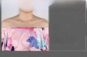 Detail view of the Bardot neckline and vibrant floral print on this slim-fit pink jumpsuit