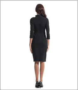 Detailed back view of a slim fit black dress with high neck and invisible zipper
