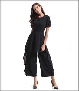 Detail of a chic black two-piece set featuring short-sleeve top and wide-leg cropped pants