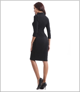 Detail view of back invisible zipper on slim fit black dress with three-quarter sleeves