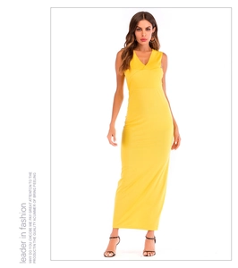 Detail of slim fit bright yellow V-neck sleeveless maxi dress with a side slit design