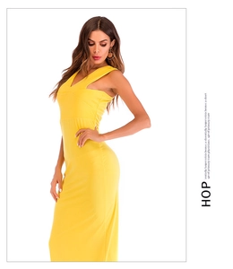 Detail view of the deep V-neck and slim fit bodice on a bright yellow sleeveless maxi dress