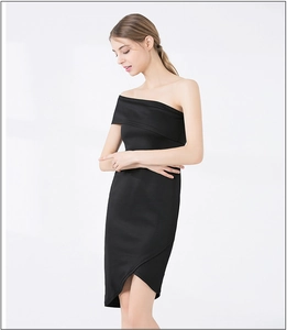 Detail view of the black one-shoulder dress with asymmetric slit hem and slim fit cut