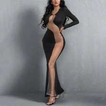 Detail of sheer mesh S-curve patchwork on a black bodycon dress with long sleeves