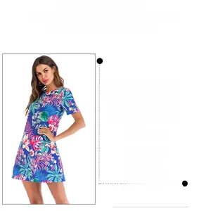 Short sleeve mini dress featuring tropical palm leaf and pink floral prints on blue base
