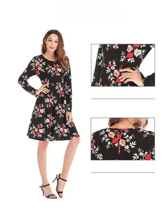 Detail view of the floral print waist and back zipper on this black long sleeve dress